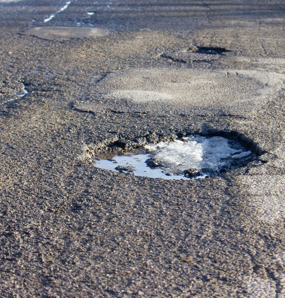 Få lappet frosthullerne i asfalten